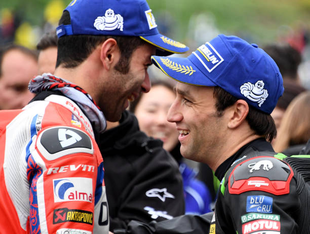 Yamaha Tech3 rider Johann Zarco of France (R) chats with Ducati rider Danilo Petrucci of Italy (L) at the parc ferme after the qualifying session of the MotoGP Japanese Grand Prix at Twin Ring Motegi circuit in Motegi