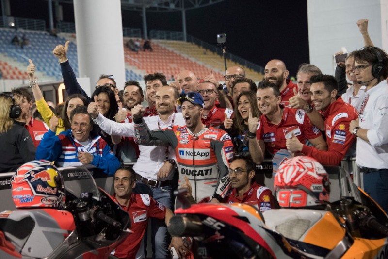 QATAR - MARCH 18:  Andrea Dovizioso of Italy and Ducati Team cuts the finish lane in front of Marc Marquez of Spain and Repsol Honda Team and celebrates the victory at the end of the MotoGP race during the MotoGP of Qatar - Race at Losail Circuit on March 18