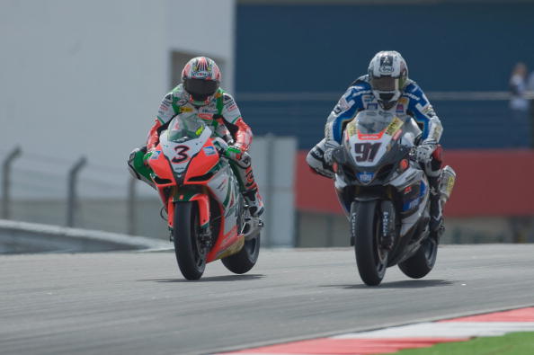 ITALY - JUNE 10:  Max Biaggi of Italy and Aprilia Racing Team leads the field during  the Race 2 of the round 7