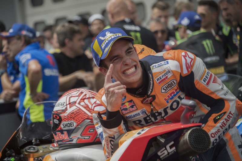 MALAYSIA - NOVEMBER 04:  Marc Marquez of Spain and Repsol Honda Team celebrates the victory on track and thanks the fans at the end of the MotoGP race during the MotoGP Of Malaysia - Race at Sepang Circuit on November 4