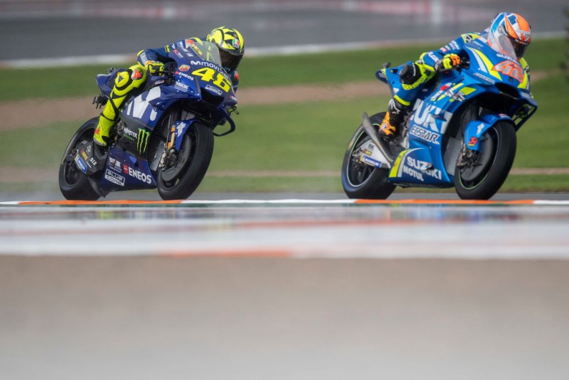 SPAIN - NOVEMBER 18:  Alex Rins of Spain and Team Suzuki ECSTAR  leads Valentino Rossi of Italy and Movistar Yamaha MotoGP  during  the MotoGP race during the MotoGP Of Valencia - Race at Ricardo Tormo Circuit on November 18