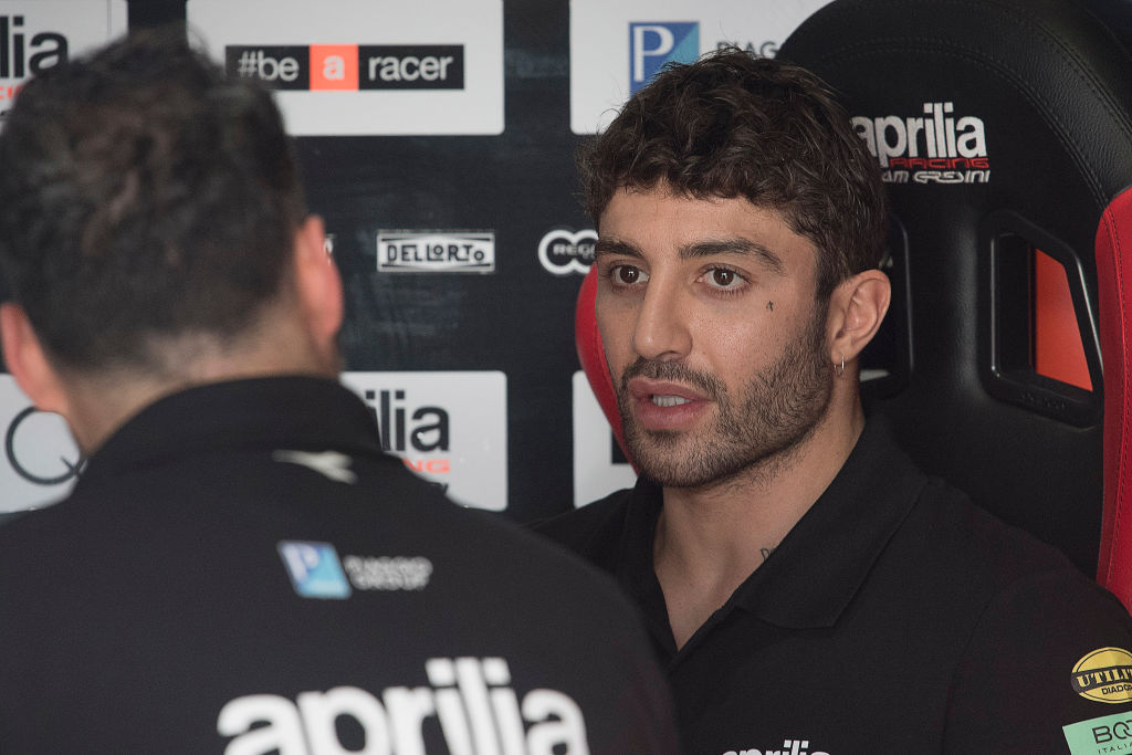 DOHA, QATAR - FEBRUARY 24: Andrea Iannone of Italy and Aprilia Racing Team Gresini speaks in box during the MotoGP Tests - Day Two at Losail Circuit on February 24, 2019 in Doha, Qatar. (Photo by Mirco Lazzari gp/Getty Images)
